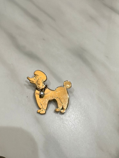 Gold-tone metal poodle brooch with black rhinestone collar
