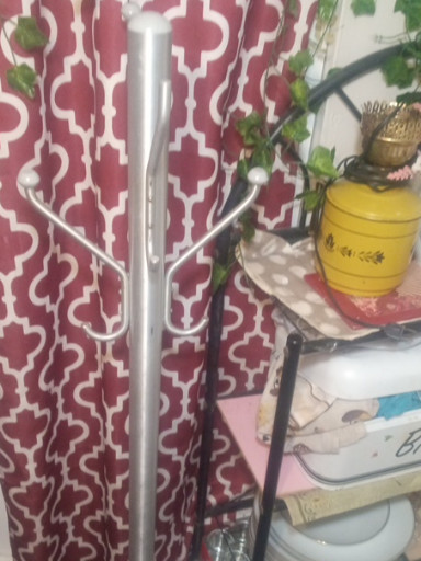 Vintage aluminum coat rack with 8 hooks and weighted circular base