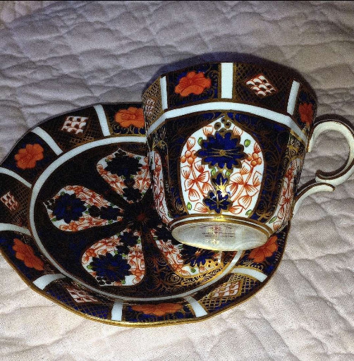 Bone china tea cup and saucer in 'Old Imari 1128' pattern by Royal Crown Derby