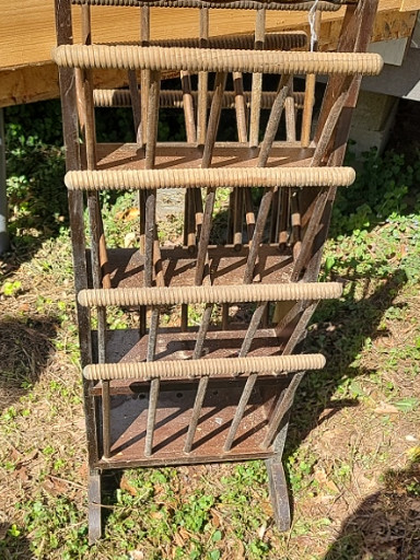 Wooden multi-tier magazine rack with turned spindles