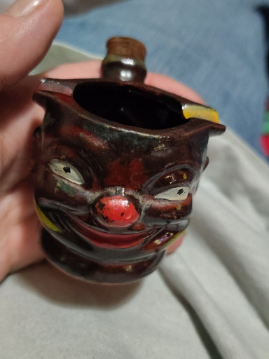 Ceramic pipe-shaped ashtray with hand-painted clown face, Japan