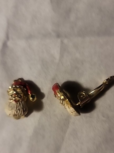 Gold-tone enamel Christmas clip-on earring set featuring Santa Claus face.