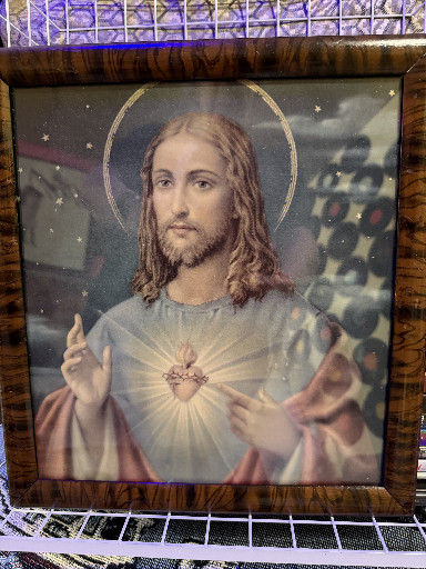 Vintage lithograph print titled 'Sacred Heart of Jesus' in wooden frame