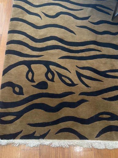 Hand-knotted wool rug (8x10 feet) with abstract wave and organic motif design in black on tan ground