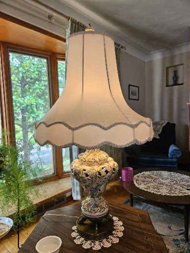 Porcelain table lamp with ornate cherub and floral relief decoration