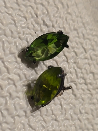 Pair of marquise-cut peridot gemstone stud earrings set in sterling silver