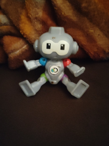 Plastic toy robot titled 'Discovery Mindblown Balance Bot' from McDonald's Happy Meal promotion