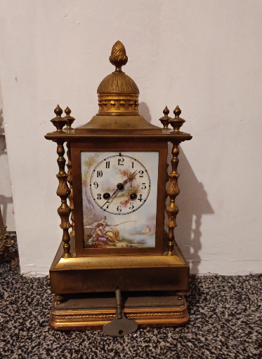 Brass mantel clock with painted enamel dial by L. Marti