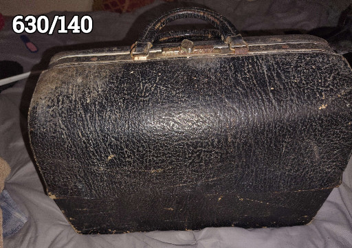 Black leather doctor's medical bag, circa 1920s-1950s