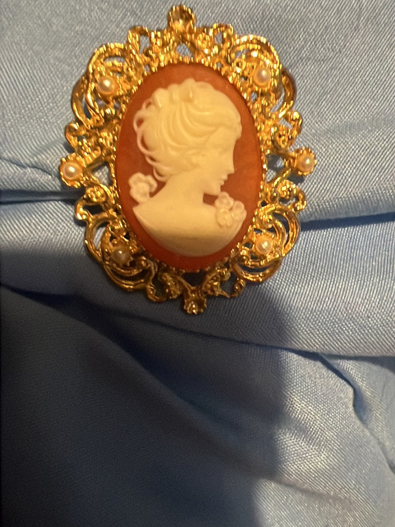 Gold-tone cameo brooch with resin carved profile by Avon