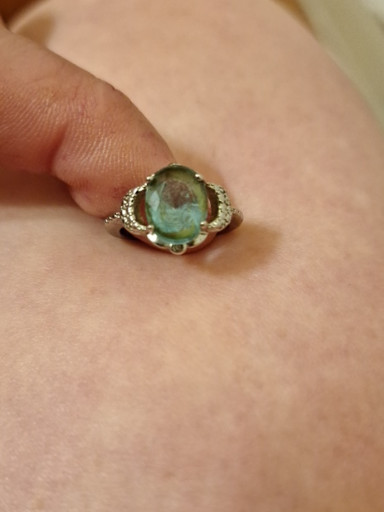 Gold ring with oval moss agate cabochon and diamond accents