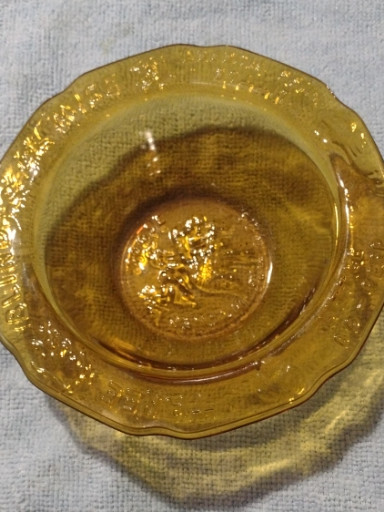Amber glass child's bowl with nursery rhyme motif by Tiara Glass