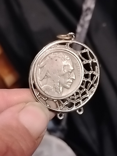Silver-toned dream catcher pendant featuring a Buffalo Nickel coin