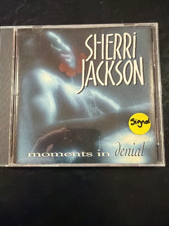 CD album titled 'Moments in Denial' by Sherri Jackson