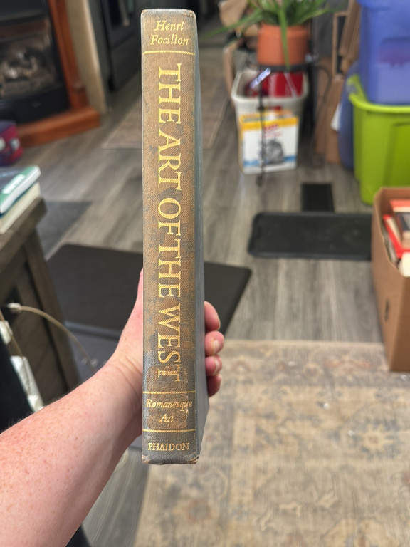 Hardcover book titled 'The Art of the West: Romanesque Art' by Henri Focillon, published by Phaidon