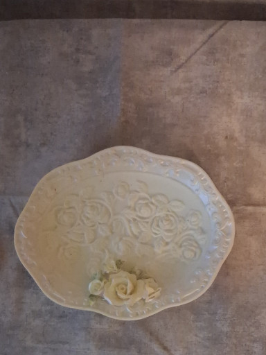 Porcelain decorative dish with embossed floral design and applied rose decoration