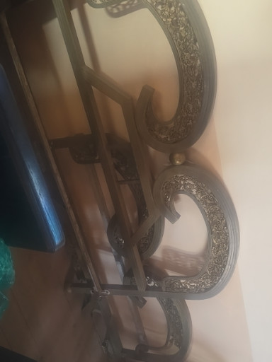 Brass bed headboard and footboard with ornate scrollwork