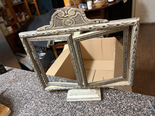 Vintage ornate silver-toned metal tabletop mirror with decorative crown crest