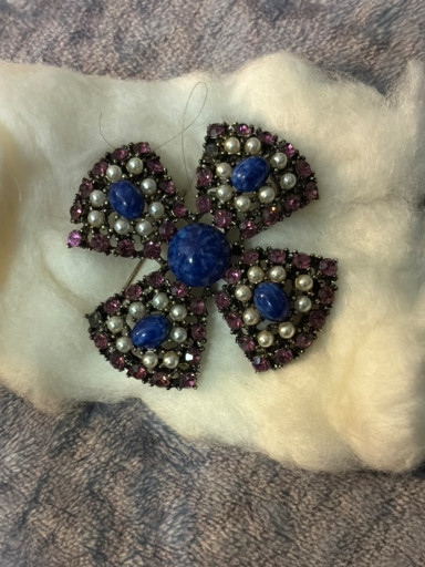 Vintage costume jewelry brooch in flower or cross design, possibly by Weiss