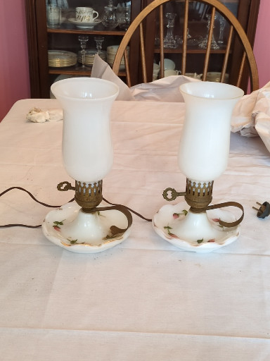 Pair of milk glass hurricane lamps with hand-painted floral decoration and brass fittings