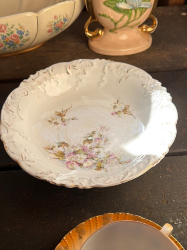 Porcelain serving bowl with floral decoration and gilt trim