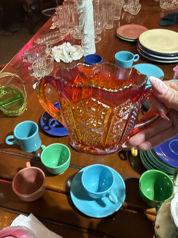 Carnival glass creamer in marigold iridescent finish, 'Paneled Daisy' pattern by Indiana Glass