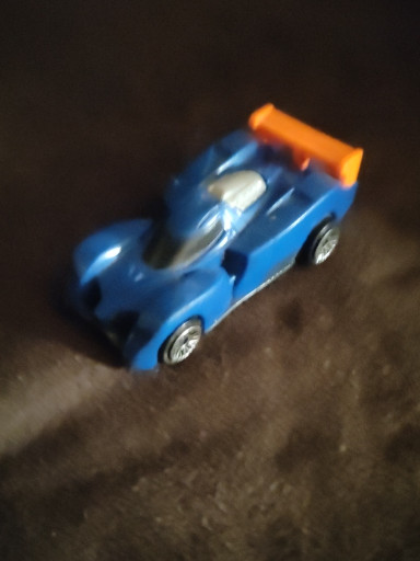 Plastic toy car titled 'Challenge Lab Pull & Go Car' from McDonald's Happy Meal Hot Wheels promotion