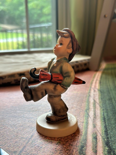 Porcelain figurine titled 'Happy Traveler' by Goebel Hummel