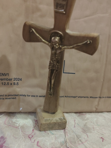 Metal crucifix with Christ figure, associated with Padre Pio Foundation of America