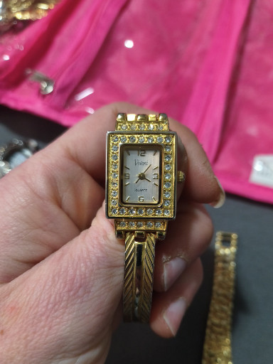 Gold-tone rectangular wristwatch with crystal-embellished bezel and twisted cable bracelet