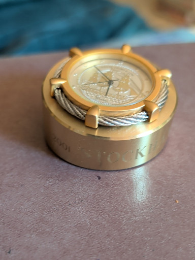 Brass desk clock/paperweight featuring USS Constitution ship medallion by Shreve, Crump & Low