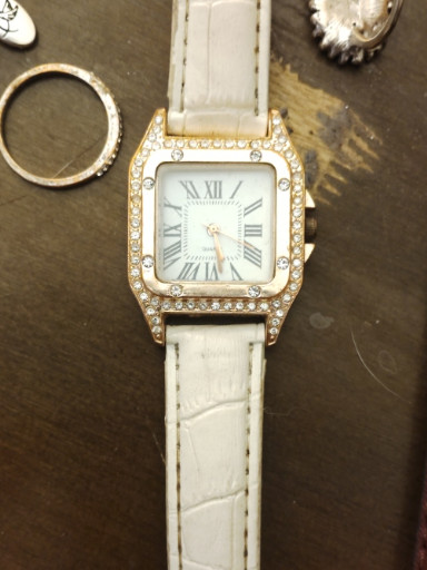 Gold-tone square quartz watch with crystal embellishments and white leather strap