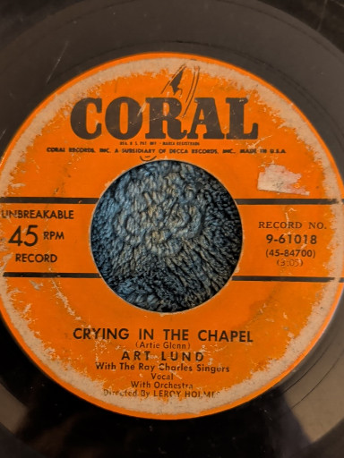 Vinyl 45 RPM single titled 'Crying in the Chapel' by Art Lund on Coral Records