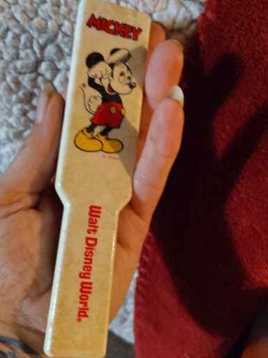 Plastic retractable hairbrush featuring Mickey Mouse, produced by Walt Disney World