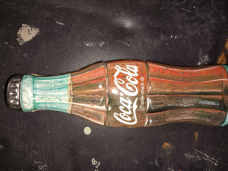 Coca-Cola bottle-shaped tin container