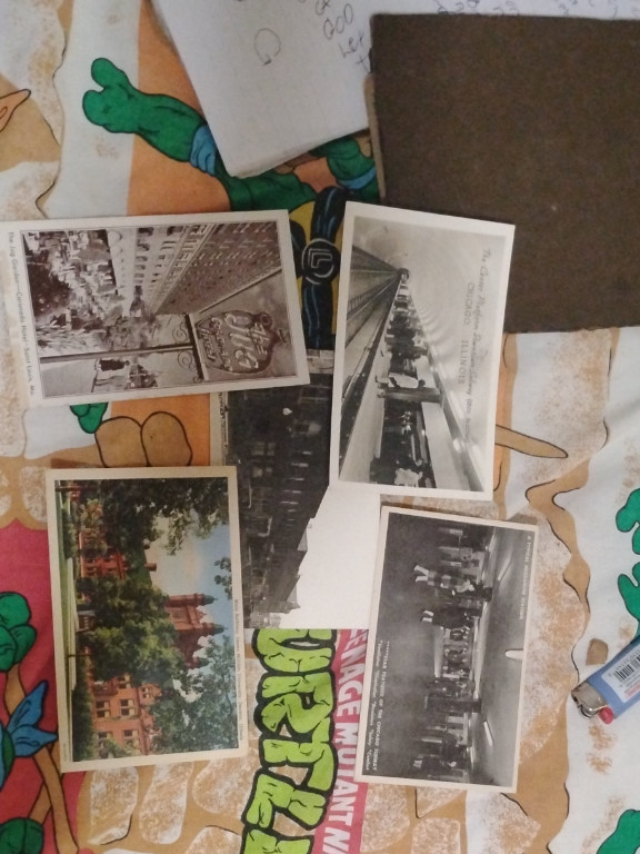 Collection of vintage postcards featuring city views