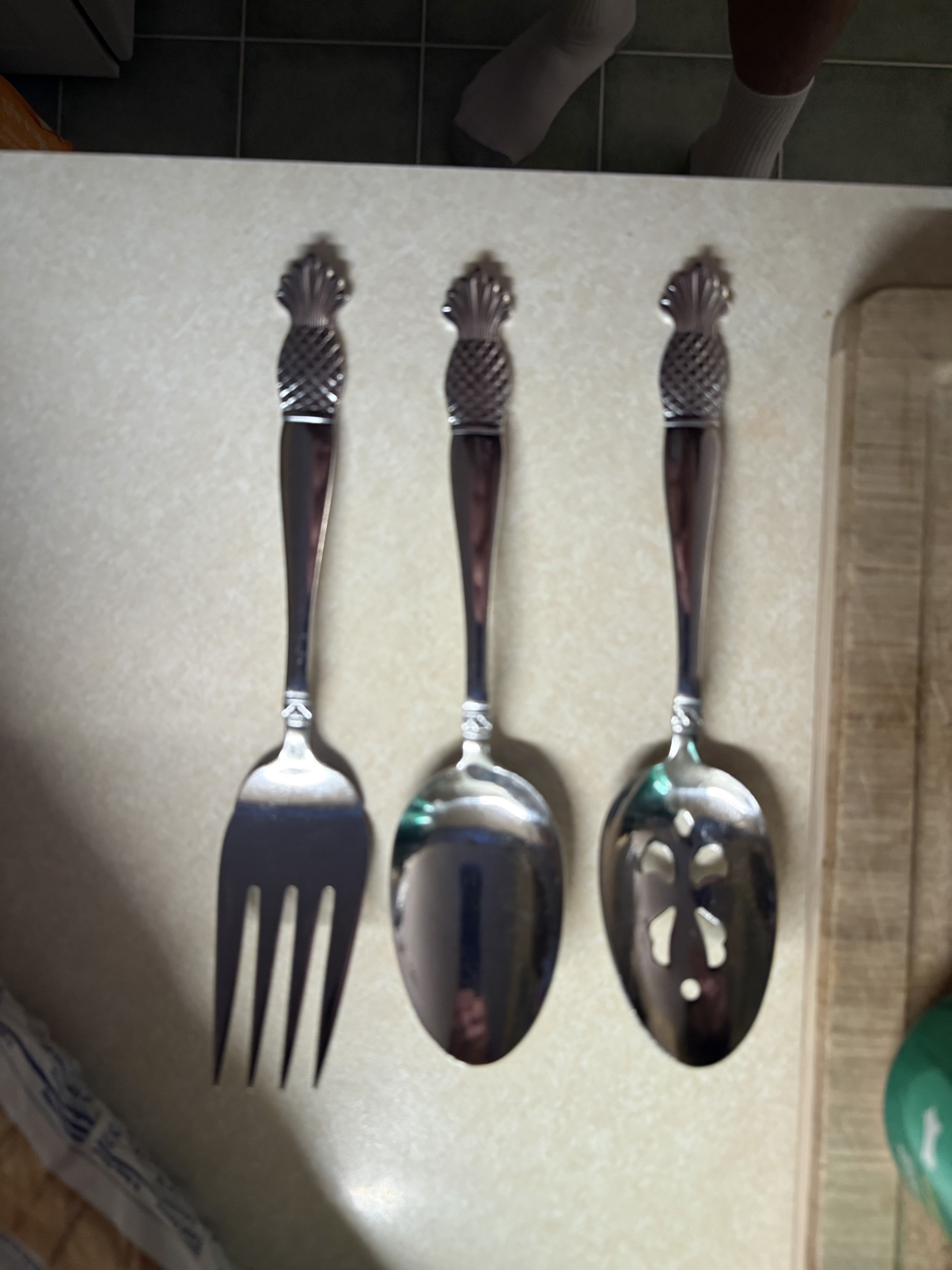 Stainless steel flatware set with pineapple design handles by International Silver Company