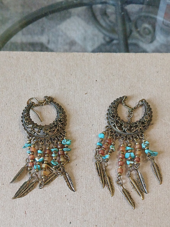 Brass filigree earrings with turquoise and coral beads and feather charms