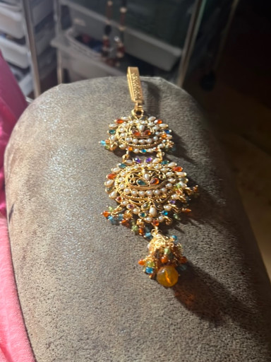Gold-plated silver pendant (tikka or jhoomar) with multicolored gemstones and pearls, South Asian traditional jewelry