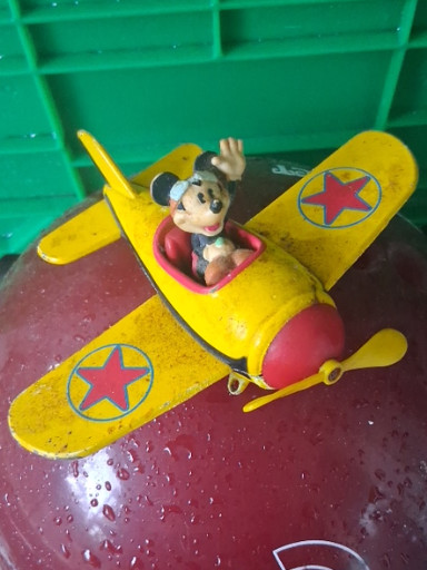 Diecast metal toy airplane featuring Mickey Mouse by DecoPac