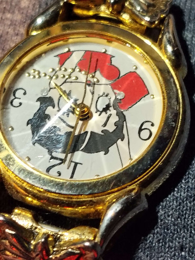 Gold-tone quartz watch featuring Tasmanian Devil character by Armitron for Warner Bros.