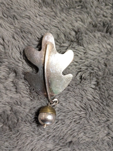 Sterling silver oak leaf brooch with dangling acorn by Anne Harvey, Mexico