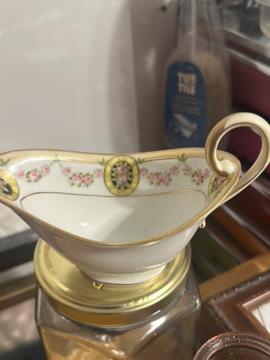 Porcelain creamer with hand-painted floral decoration and gold trim, early 20th century Nippon
