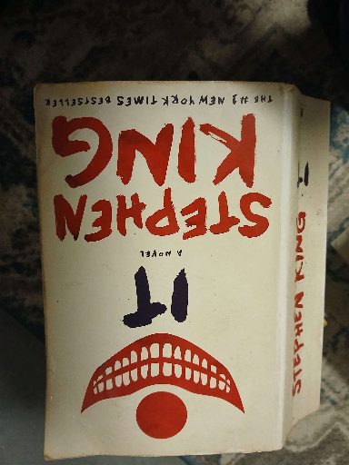 Paperback novel titled 'IT' by Stephen King