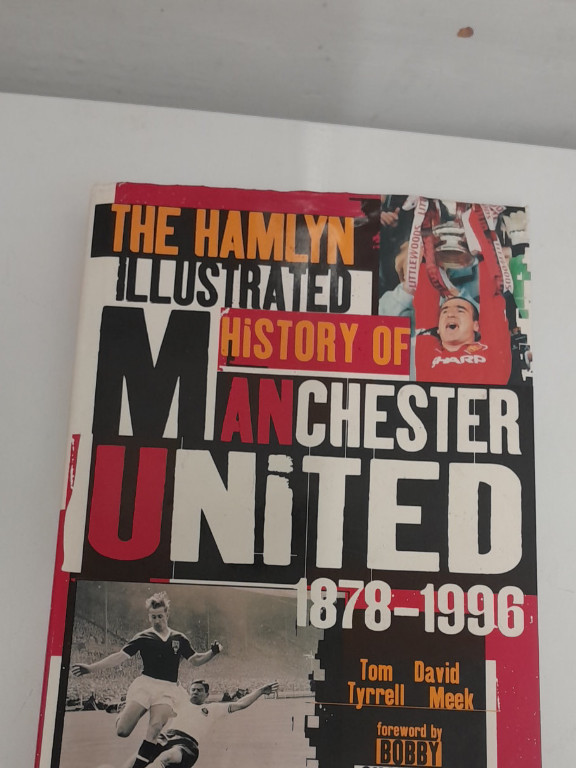 Book titled 'The Hamlyn Illustrated History of Manchester United 1878-1996' by Tom Tyrrell and David Meek