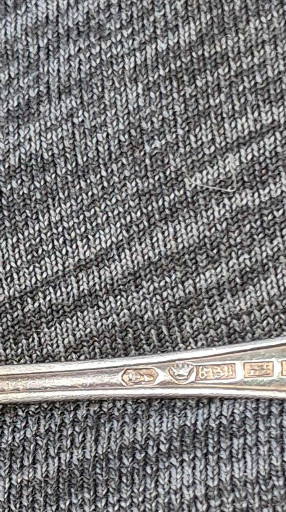 Sterling silver serving fork with hallmarks, likely English origin