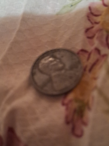 United States coin, appears to be a Washington Quarter or Roosevelt Dime with possible strike-through or grease-filled die error