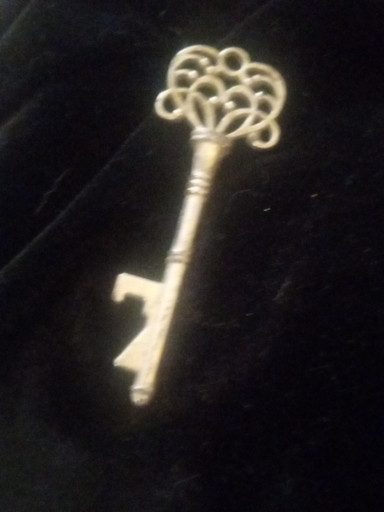 Decorative skeleton key brooch or pin in gold-tone metal