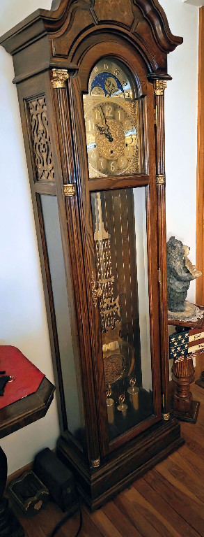 Wooden grandfather clock with moon phase dial by Pearl Grandfather Clocks