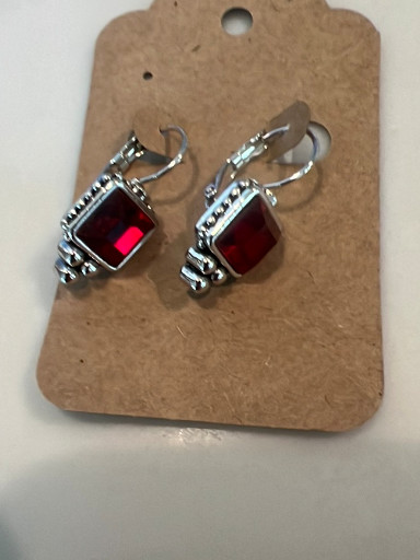 Sterling silver dangle earrings with red gemstone (likely garnet or synthetic stone)